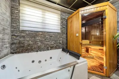 a large bathroom with a white bath tub at Aqualux Apartment with garage in Belgrade