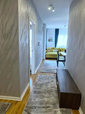 a living room with a couch and a table at PLEASURE LUX Bg in Belgrade
