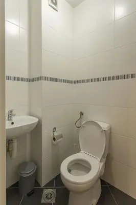 a bathroom with a toilet and a sink at PLEASURE LUX Bg in Belgrade