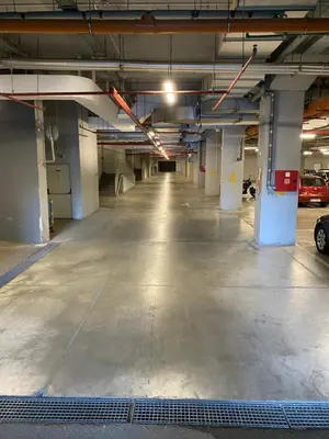 an empty parking garage with a car parked in it at PLEASURE LUX Bg in Belgrade