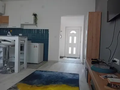 a kitchen with a blue and white at ALEJA park in Železnicka Stanica Inđija Selo