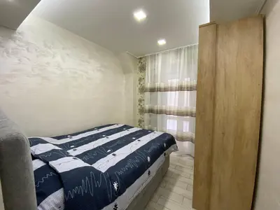 a small bedroom with a bed and a window at Daca 1 in Belgrade
