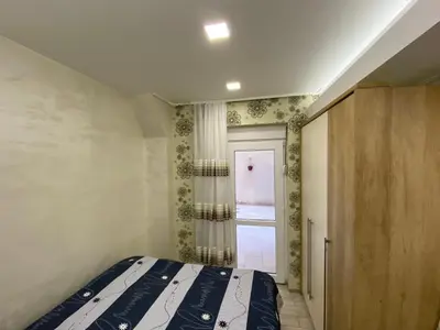 a bedroom with a bed and a window at Daca 1 in Belgrade