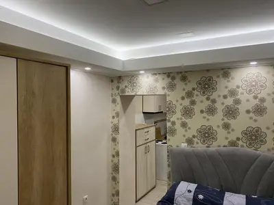 a room with a kitchen and a couch in a room at Daca 1 in Belgrade