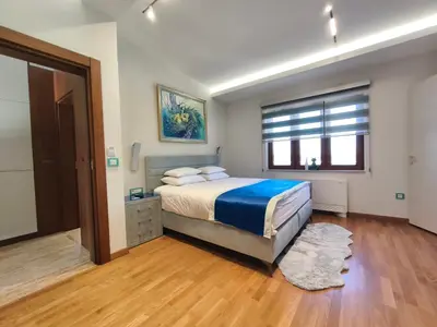 a bedroom with a large bed and a window at Muzej Accommodation in Repnica