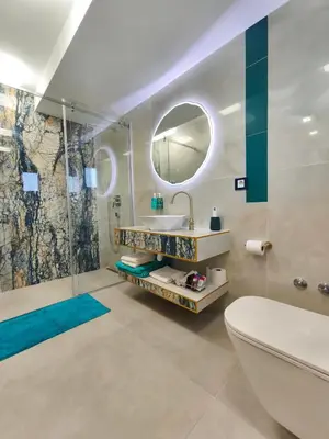 a bathroom with a sink and a shower at Muzej Accommodation in Repnica