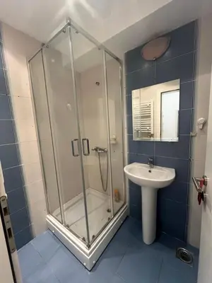 a bathroom with a shower and a sink at Manu in Belgrade