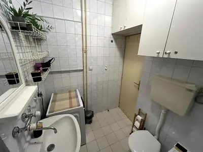 a small bathroom with a toilet and a sink at Arena view in Belgrade