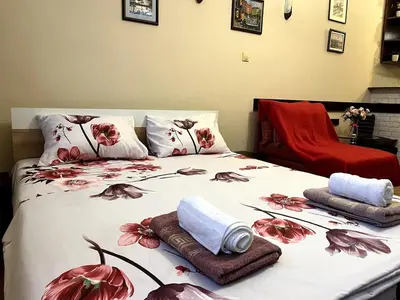a bed with towels and pillows on it at Arena view in Belgrade