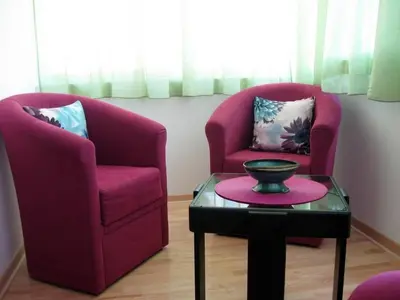 two purple chairs and a table in a room at 12 Beds 4 Baths 2 Renovated Apts 2nd & 3rd Flr in Belgrade