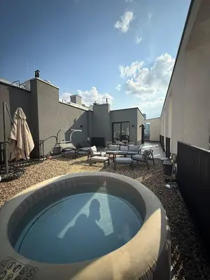 a swimming pool on the roof of a building at Penthouse with River View BW in Belgrade