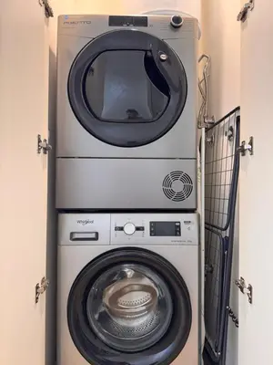 a washing machine and a dryer in a room at Beograd na vodi - Belgrade Waterfront Apartments in Belgrade
