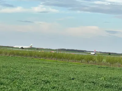 an airport runway with an airplane on the runway at airport Belgrade 2bedrooms in Surčin