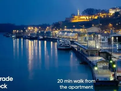 a view of a river at night with a city at Apartment Center Belgrade in Belgrade