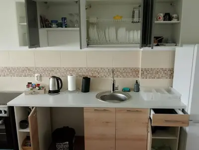 a kitchen counter with a sink in a kitchen at Arena Usce Confluence in Belgrade