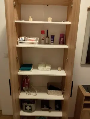 a cupboard filled with lots of shelves at Arena Usce Confluence in Belgrade