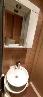 a bathroom with a white sink and a mirror at Chic apartment Dorćol in Belgrade