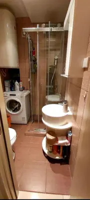 a bathroom with a sink and a washing machine at Chic apartment Dorćol in Belgrade
