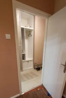 a room with a door open to a room with a mirror at Chic apartment Dorćol in Belgrade