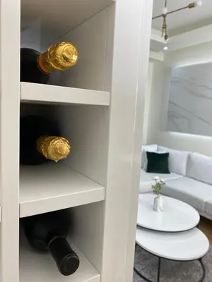 a wine cellar with wine bottles and a couch at Belgrade Waterfront Lux Vista -free parking in Belgrade