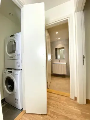 a laundry room with a washing machine and a washer at Belgrade Waterfront Lux Vista -free parking in Belgrade