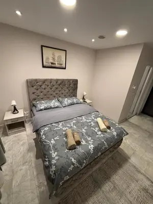 a bedroom with a bed with two pillows on it at Apartman Knez in Belgrade