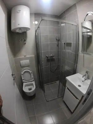 a bathroom with a shower and a toilet and a sink at Apartman Knez in Belgrade
