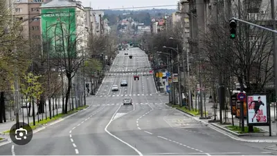 an empty road in a city with cars on it at Apartman Knez in Belgrade