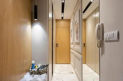 a hallway with a door and a phone in a room at Mini Dorćolka apartment -Dorćol in Belgrade