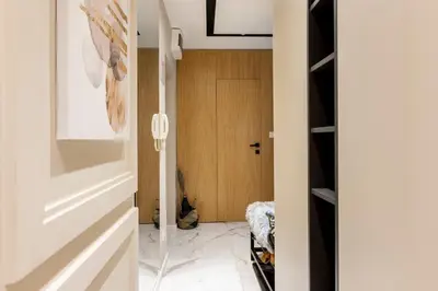 a hallway with a door leading to a closet at Mini Dorćolka apartment -Dorćol in Belgrade