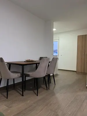 a dining room with a table and chairs at Mimura stan in Belgrade