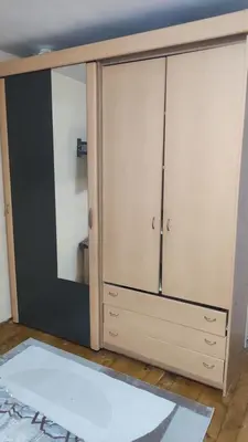 a closet with a mirror and a dresser in a room at Goxy flat in Belgrade