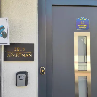 a door with a sign that reads zeus apartmentarian at Zeus Apartment in Rakovica