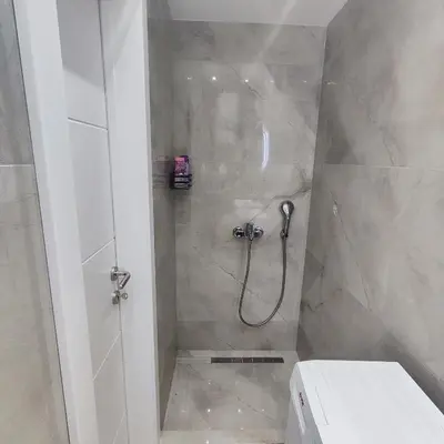 a bathroom with a shower with a toilet at Zeus Apartment in Rakovica