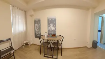 a dining room with a table and two chairs at Center Point apartment in Belgrade