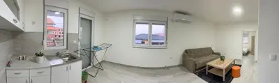 a living room with a couch and a table at Airport Art Villa in Čukarica