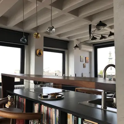 a kitchen with a black counter and a sink at Exceptional City Center River View Apartment in Belgrade