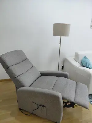 a grey couch in a living room with a lamp at Premium Belvil apartment, free parking in Belgrade