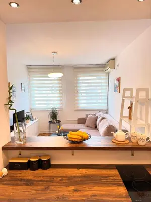 a living room with a couch and a table at Ada Zen in Belgrade