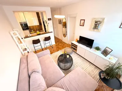 a living room with a couch and a tv at Ada Zen in Belgrade