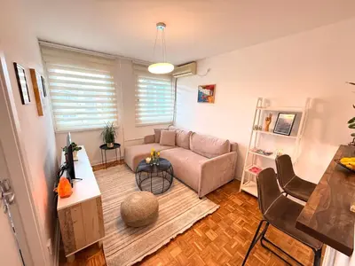 a living room with a couch and a table at Ada Zen in Belgrade