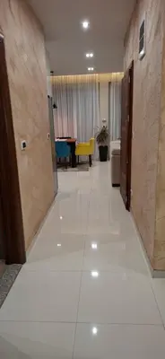 a hallway with a living room and a dining room at Apartman Laki-M in Belgrade