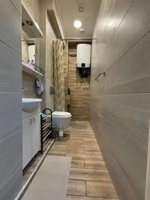 a bathroom with a tub and a toilet and a sink at Apartment Dana in Belgrade
