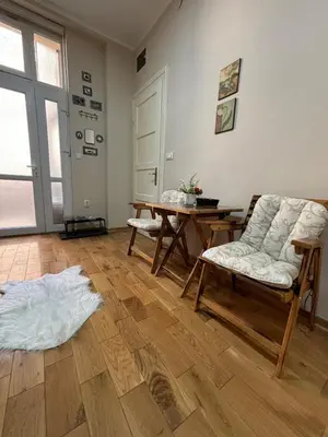 a living room with a couch and a table at Apartment Dana in Belgrade