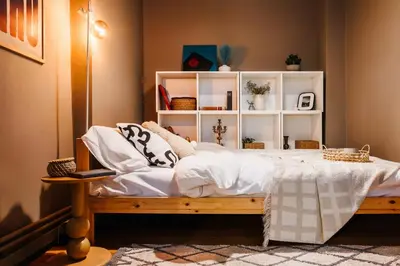 a bedroom with a large bed with white shelves at Inspiration Source with Balcony Old Town in Belgrade