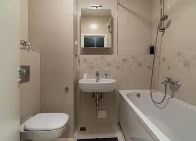 a bathroom with a sink and a toilet and a tub at Apartman Fox in Belgrade