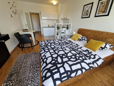 a bedroom with a large bed in a room at Apartman Fox in Belgrade
