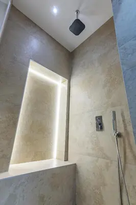 a shower with a glass door in a bathroom at Skadarlija Aurora in Belgrade