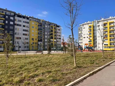 a park with trees and buildings in a city at Cosy Retreat 135 in Belgrade