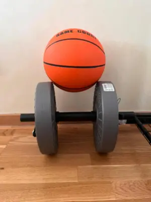 an orange basketball on a wheelchair with wheels at Cosy Retreat 135 in Belgrade